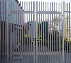 A galvanized palisade swing pedestrian gate with double leaves