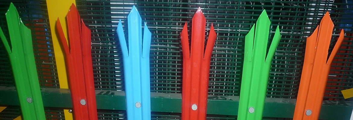 Six PVC coated palisade fence pales in red, blue, orange and green
