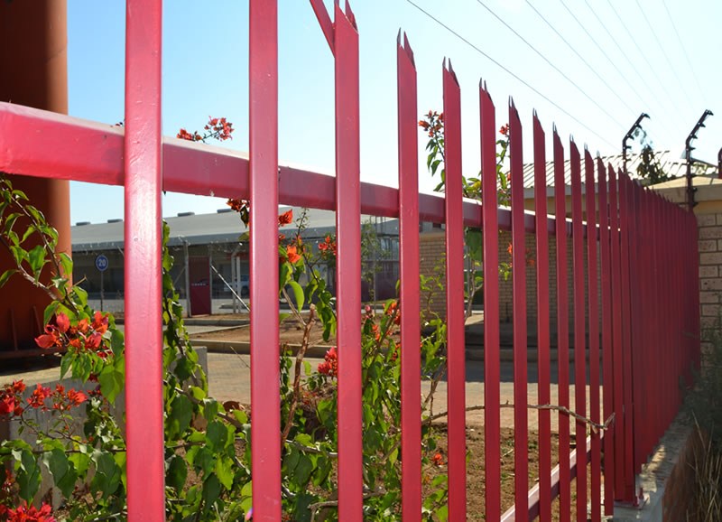 Red color palisade fence for factory yard fencing with angle pales in double pointed top shape.
