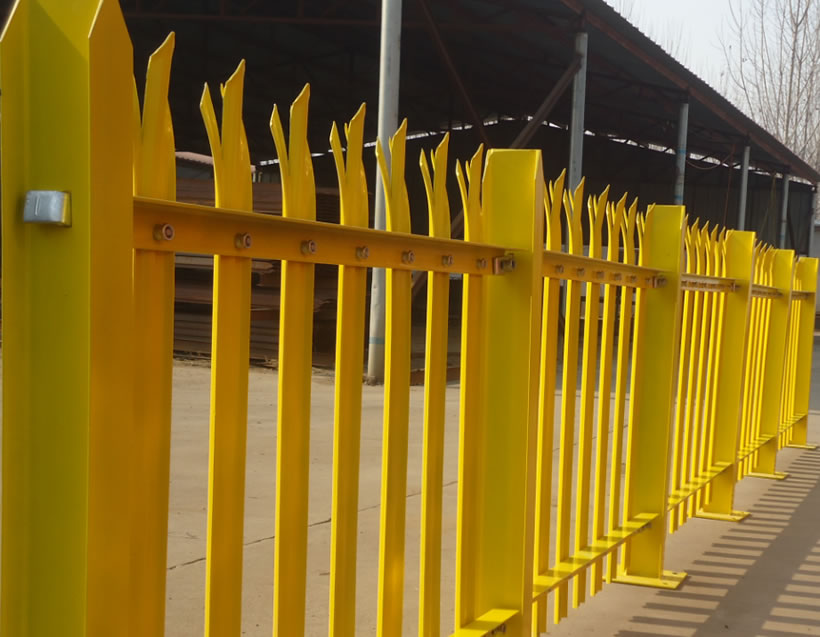 Yellow polymer coating palisade fencing with corrugated pales in our factory.